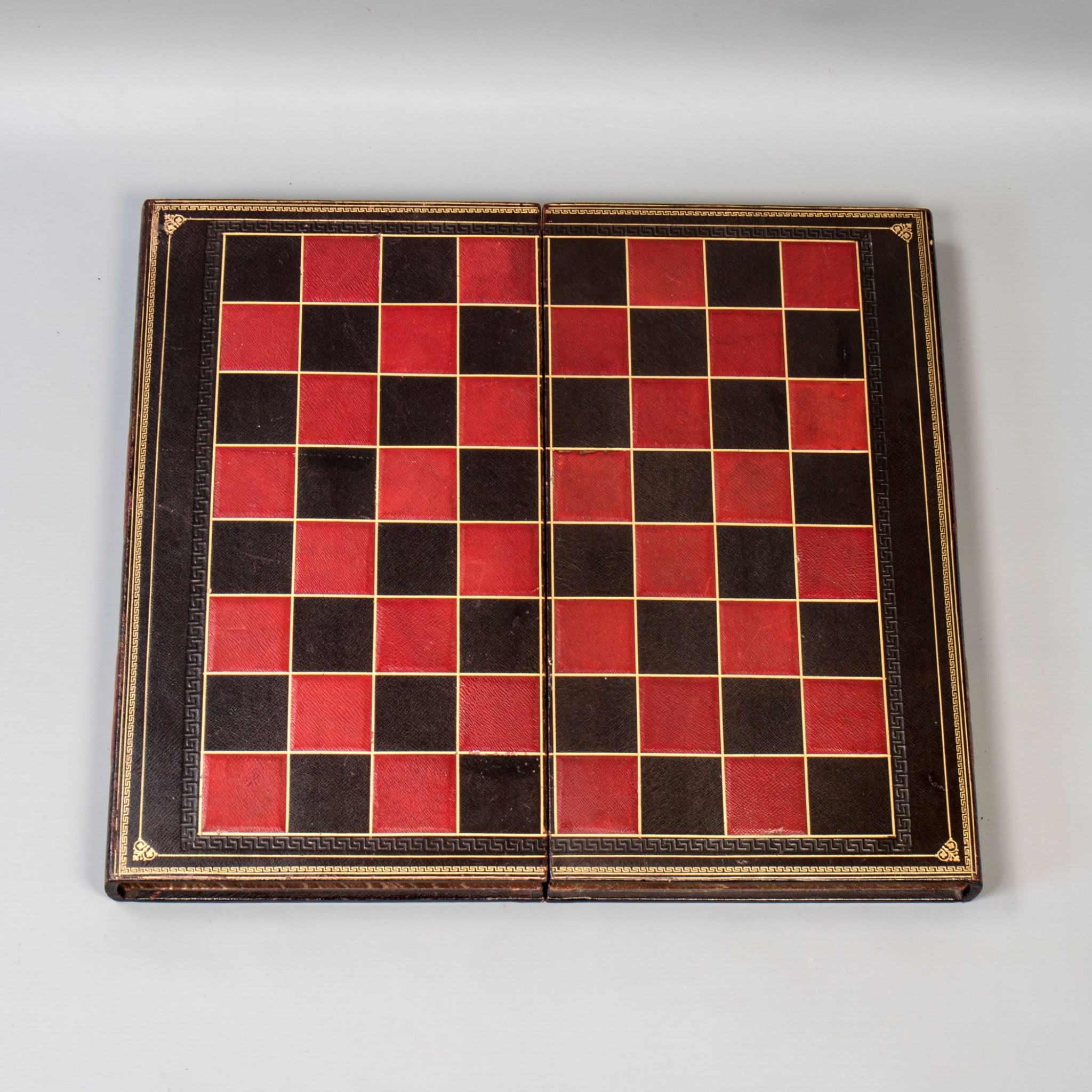 A Vintage Tooled Leather Backgammon, Chess & Draughts Board with ...